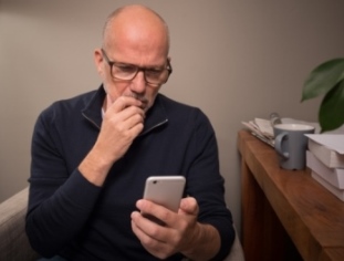 Man looking at cell phone