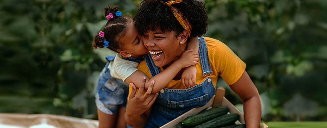 Mother and daughter hugging