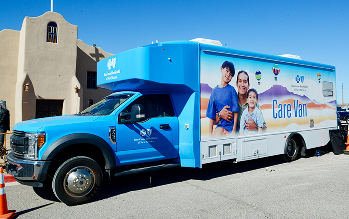 A Care Van is parked at a mobile health clinic. 