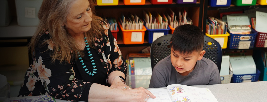 Teacher helps student with homework