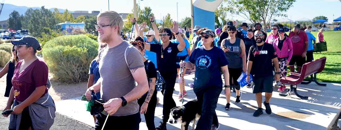 Employees and community members at outdoor walk event